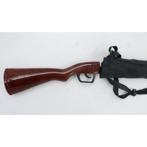 2071 - An umbrella with the handle in the form of a rifle stock, handle loose. UK P&P Group 3 (£30+VAT for ... 