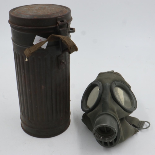 2106 - German WWII Luftshutz issue gas mask in cylindrical cannister, with a British military issue gas mas... 