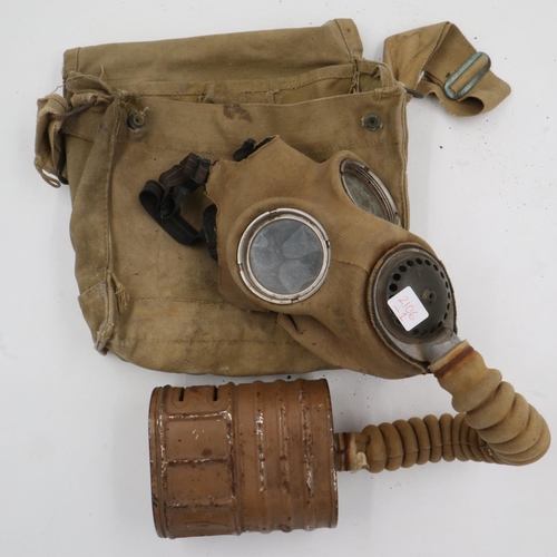 2106 - German WWII Luftshutz issue gas mask in cylindrical cannister, with a British military issue gas mas... 