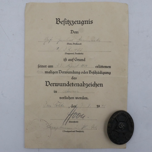 2243 - WWII German 3rd Class Wound badge in black (representing iron), with award certificate to a soldier ... 