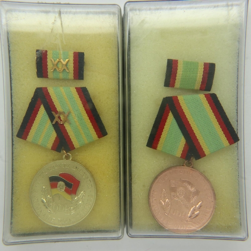 2258 - Pair of Original East German DDR NVA & Stasi cased Long Service medals. UK P&P Group 1 (£16+VAT for ... 