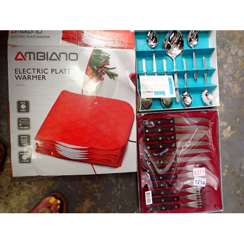 1214 - Two boxed cutlery sets and an electric plate warmer. Not available for in-house P&P