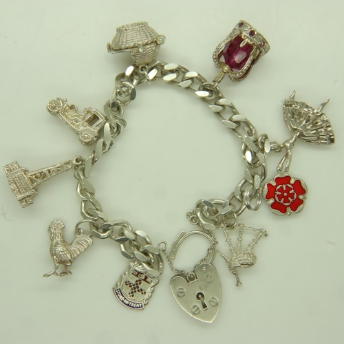 37 - 925 silver charm bracelet with nine charms, including a bagpipe charm, L: 15 cm, 44g. UK P&P Group 1... 