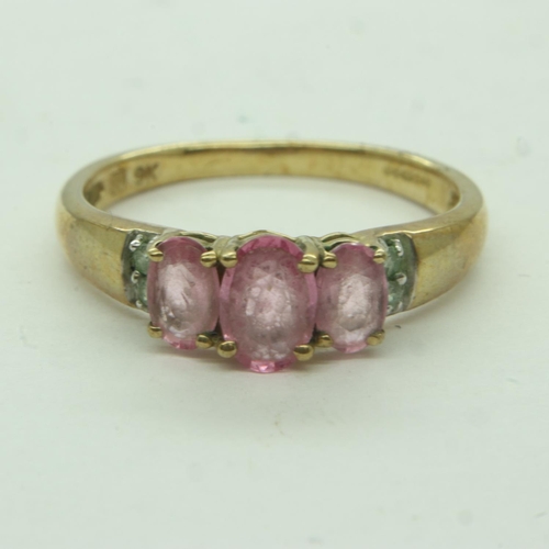 42 - 9ct gold ring, set with three pink stones and white stones to the shoulders, size P, 2.0g. UK P&P Gr... 