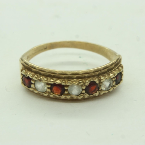 43 - 9ct gold half eternity ring set with garnets and cubic zirconia, size K, 1.7g. UK P&P Group 0 (£6+VA... 