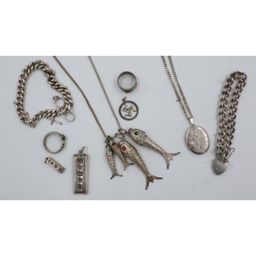 56 - Collection of sterling silver jewellery items, including charm bracelets, ingot pendants, articulate... 