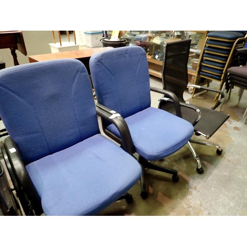 1562 - Two modern upholstered swivel office chairs and another. Not available for in-house P&P