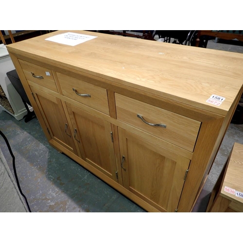 1581 - Large pine side board, three drawers over three cupboards, 131 x 91 cm. Not available for in-house P... 