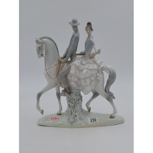 230 - Very large Lladro figural group of a couple on horseback, H: 43 cm, no cracks or chips, no issues no... 