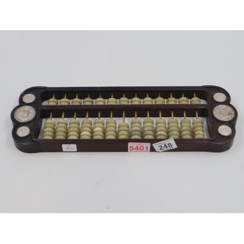 248 - Early 20th century hardwood and Jade abacus, inset with silver coins, L: 42 cm. UK P&P Group 2 (£20+... 