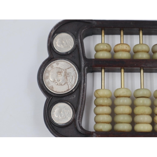 248 - Early 20th century hardwood and Jade abacus, inset with silver coins, L: 42 cm. UK P&P Group 2 (£20+... 