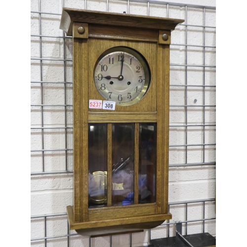 308 - Oak cased 1940's wall clock, pendulum and key present, 69cm H. Not available for in-house P&P