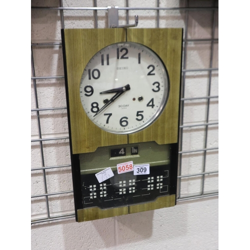 309 - Seiko 30 day cased wall clock, 26 x 43cm H. Not available for in-house P&P