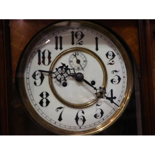 311 - Mahogany cased Vienna wall clock, pendulum, weights and key present, 148cm H. Not available for in-h... 