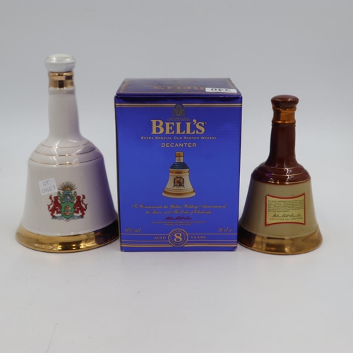 340 - Three Bells Whisky decanters, 75cl Queen's 60th birthday, 70cl Queen's Golden wedding boxed and a 35... 