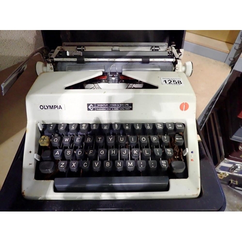 1258 - Cased Olympia typewriter. Not available for in-house P&P