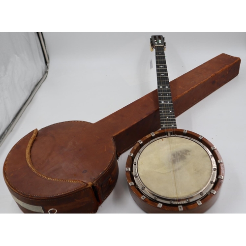 277 - Five string banjo, trainee luthier made. Leather bound case included. No makers marks and signs of b... 