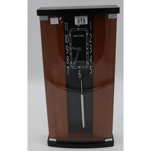 315 - Rhythm modern wood and glass chiming wall clock, with pendulum. Not available for in-house P&P