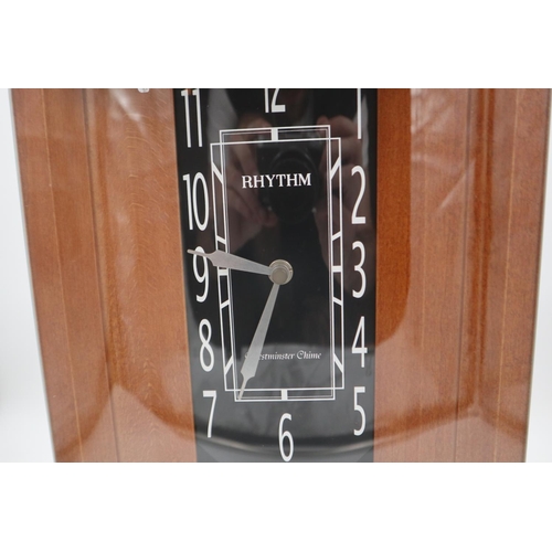 315 - Rhythm modern wood and glass chiming wall clock, with pendulum. Not available for in-house P&P