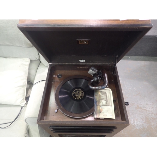 1584A - His Masters Voice, model 153 console gramophone, with instructions. Working at lotting up. 50 x 80cm... 