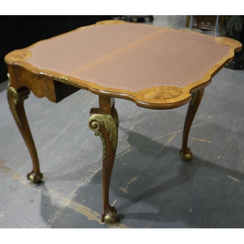 2059 - 20th century burr walnut fold-over card table, with gilt mouldings, brown baize interior and raised ... 