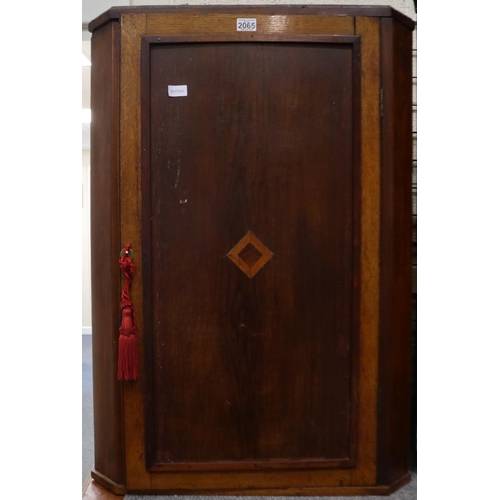 2065 - George III mahogany and walnut wall-hanging corner cupboard, single door with three fixed shelves wi... 