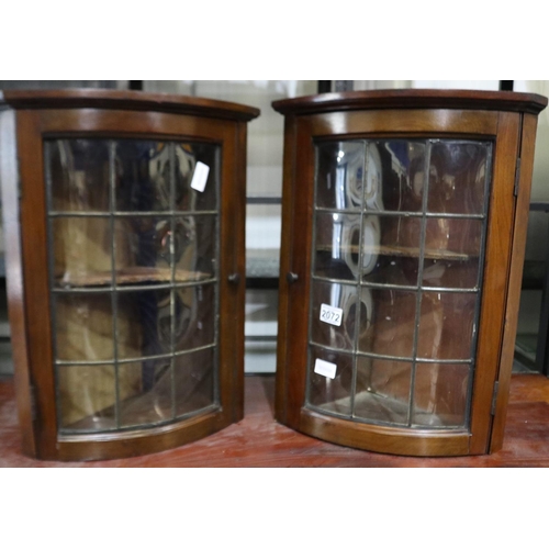 2072 - A pair of 19th century diminutive wall-mounting offset corner cabinets, each having a bowed leaded g... 