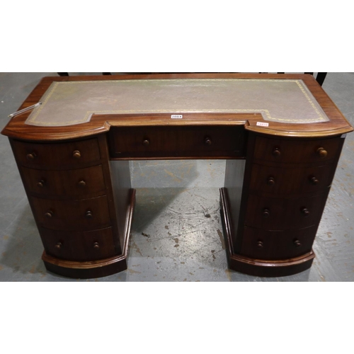 2084 - A Victorian kneehole twin-pedestal writing desk, having two flights of bowed drawers and tooled leat... 