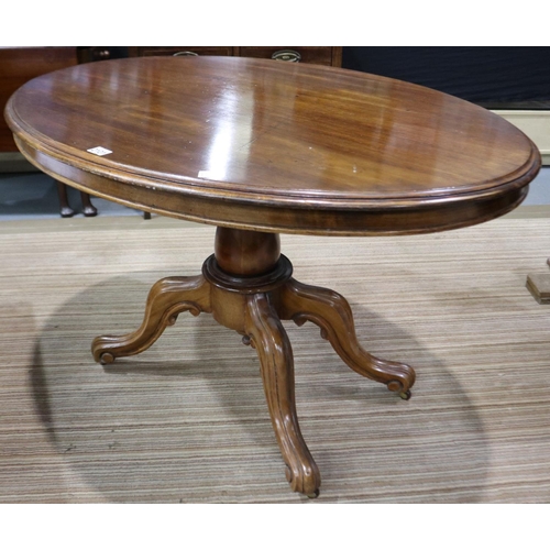 2101 - A 19th century oval loo table, with tilting top and carved quadripartite support, 119 x 88 x 75 cmH.... 