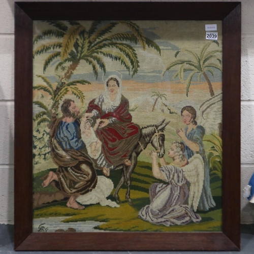 2039 - A Victorian religious woolwork panel, Flight Into Egypt, 73 x 70 cm, frame 85 x 82 cm. Not available... 