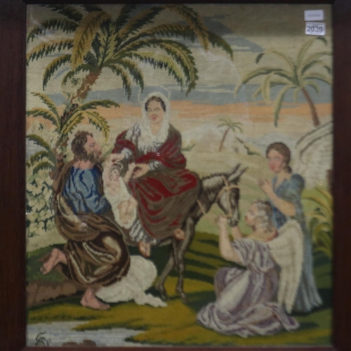 2039 - A Victorian religious woolwork panel, Flight Into Egypt, 73 x 70 cm, frame 85 x 82 cm. Not available... 