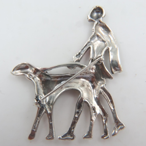 41 - Unmarked white metal Art Deco design enamelled brooch, lady walking a dog, H: 40 mm. UK P&P Group 0 ... 