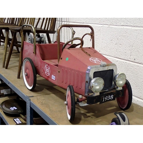 1012 - Unbranded toy fire department pedal car, with hose. 95cm L. Not available for in-house P&P