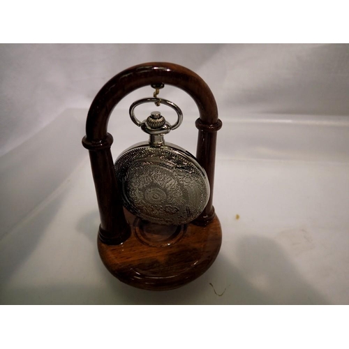 1059 - Pocket watch presented on walnut stand - working at lotting up. UK P&P Group 1 (£16+VAT for the firs... 