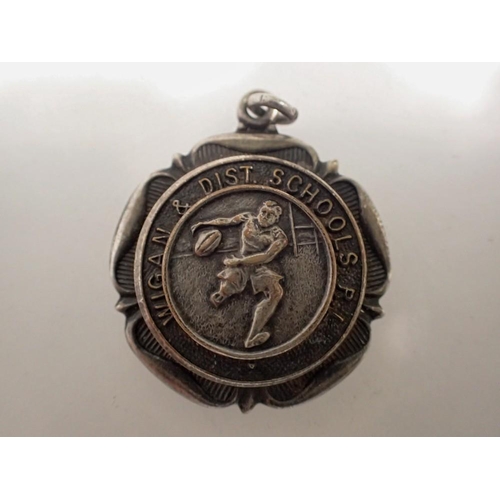 1085 - Wigan and district schools rugby silver fob. UK P&P Group 0 (£6+VAT for the first lot and £1+VAT for... 