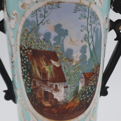 246 - Large continental twin handled vase with handpainted panel decoration, 51cm H, handles are overpaint... 