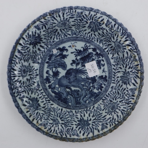 293 - Chinese ceramic plate/shallow bowl with flower mark within double blue ring to base, D: 22 cm. UK P&... 