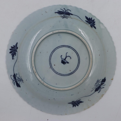 293 - Chinese ceramic plate/shallow bowl with flower mark within double blue ring to base, D: 22 cm. UK P&... 