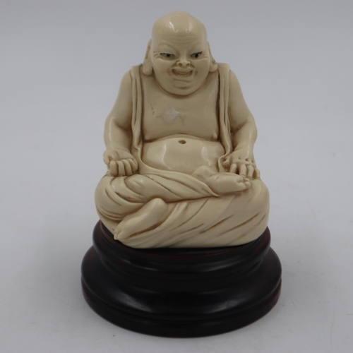 299 - Resin seated figure of Buddha on a turned hardwood base, overall H: 16 cm. UK P&P Group 2 (£20+VAT f... 