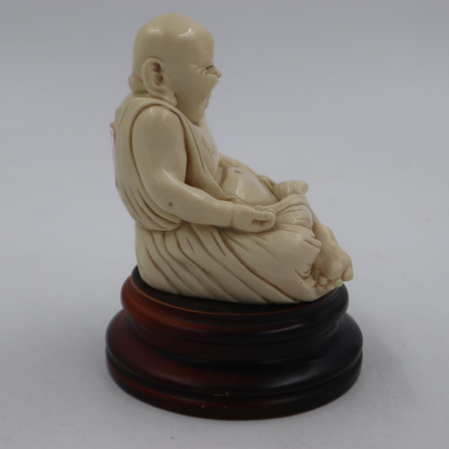 299 - Resin seated figure of Buddha on a turned hardwood base, overall H: 16 cm. UK P&P Group 2 (£20+VAT f... 