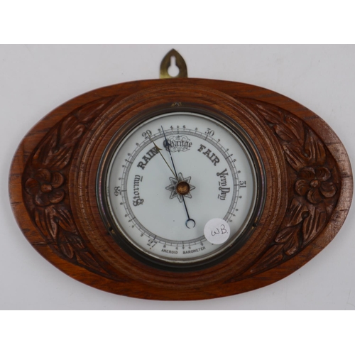 320 - Carved wood wall barometer, L: 26 cm. Not available for in-house P&P