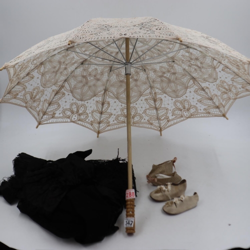 342 - 20th century crochet-work parasol, two pairs of infant boots and a mourning cap in black with lace t... 