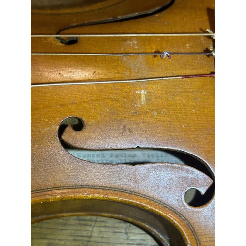 331 - Konrad Paulus full size violin with a two piece back and ebony tuning pegs, bears label inside Konra... 