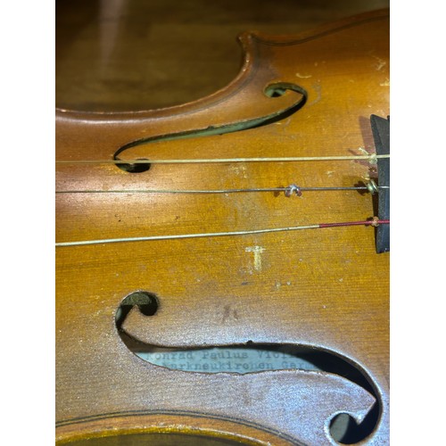 331 - Konrad Paulus full size violin with a two piece back and ebony tuning pegs, bears label inside Konra... 