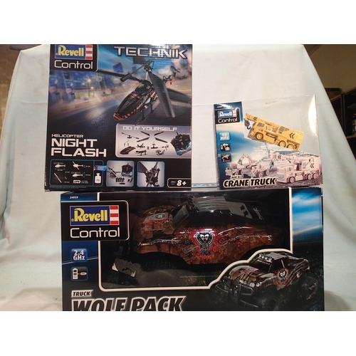 2056 - Three Revell radio control vehicles, Wolf Pack truck, Night Flash helicopter and mini crane truck, a... 