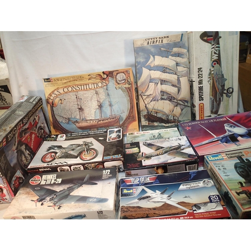 2058 - Approximately thirty plastic kits, various makes, aircraft, motorcycle, railway, ships etc, all star... 