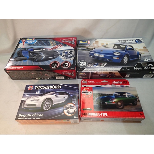 2063 - Four model car plastic kits, Airfix Bugatti Chiron and E type Jag, Revell New Type Beetle and Revell... 