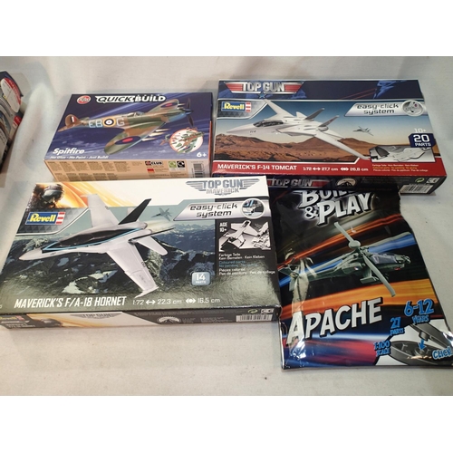 2071 - Four easy build plastic kits, Apache, Top Gun Hornet, Top Gun Tomcat, and Spitfire, as new, ex shop ... 