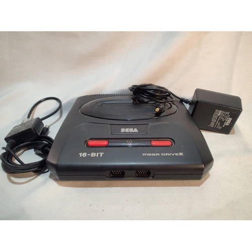 2167 - Unboxed Sega Mega Drive II with PSU and AV/RF unit, powers up and lights up. UK P&P Group 2 (£20+VAT... 