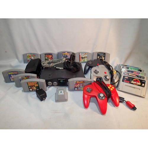 2172 - Unboxed Nintendo 64 with PSU, three controllers, rumble pack nine games in a carry case and five SNE... 